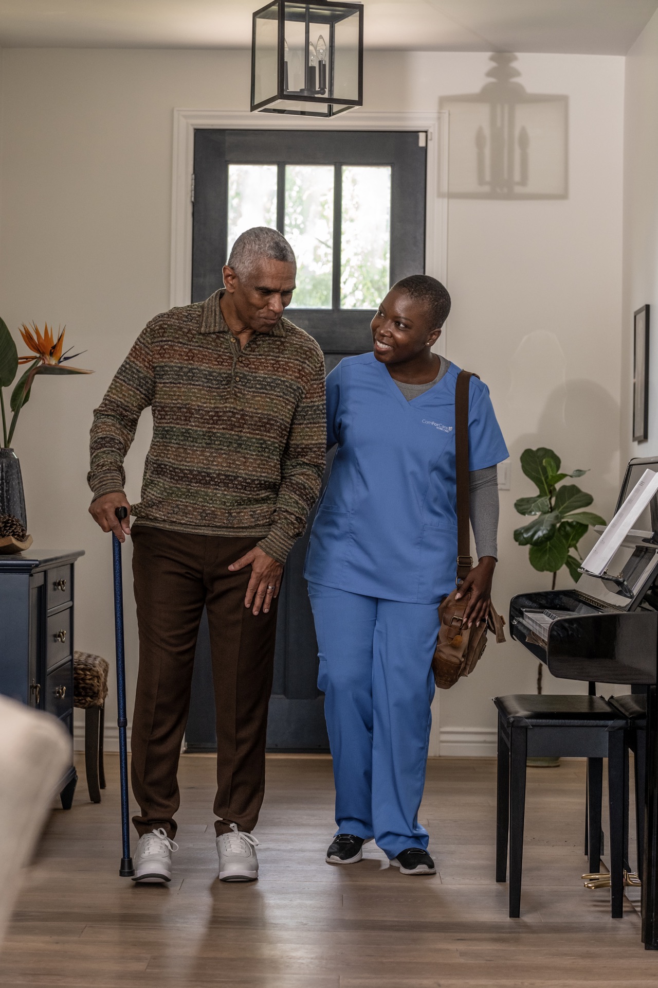 Caregiver walking with senior